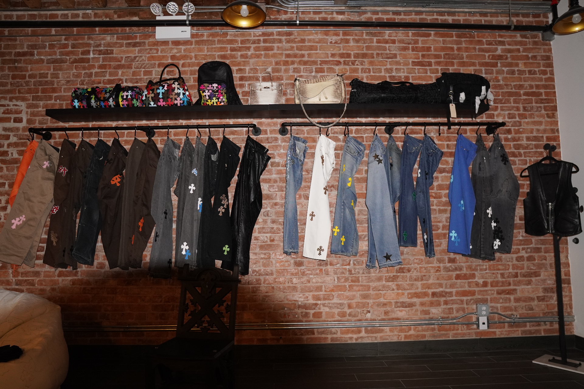 Chrome Hearts denim and bag wall in the Once Legos NYC showroom