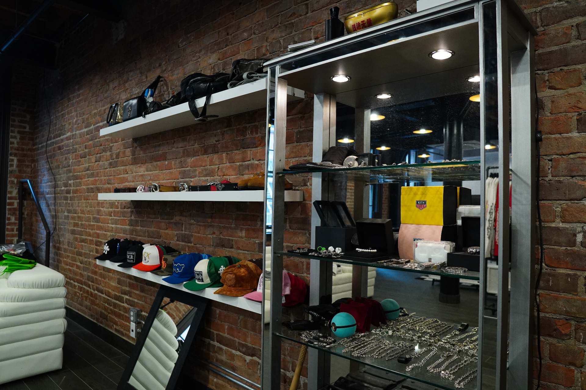 Hats, accessories, and silver jewelry case in the Once Legos NYC showroom