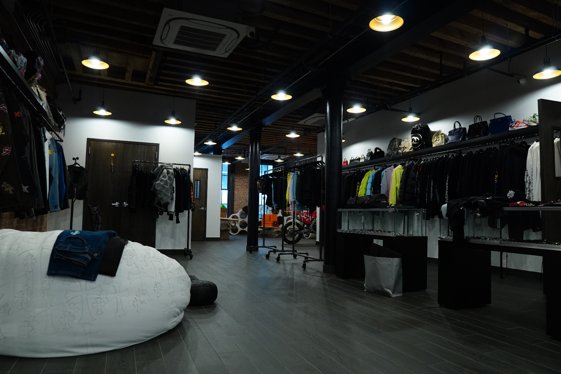 Inside the Once Legos NYC showroom — racks of Chrome Hearts hoodies, denim, and rare bags